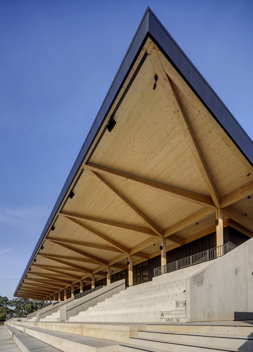 dwp | design worldwide partnership crafts exquisite sustainable design with the newly completed timber architecture of the Eric Tweedale Stadium, Granville Park, Merrylands NSW Australia. — image