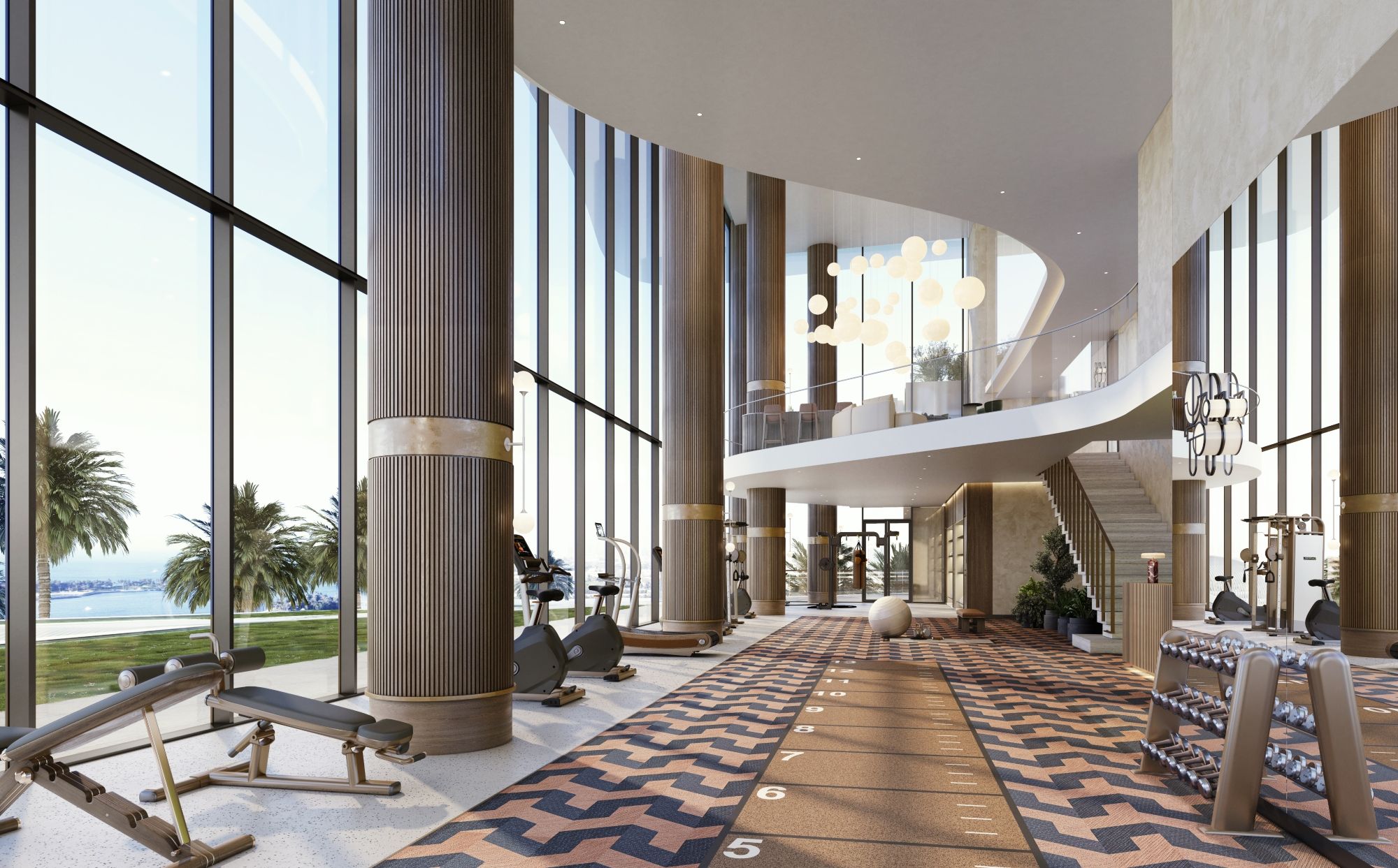 Double-height gym at Sensia by Beyond in Dubai with floor-to-ceiling windows, Art Deco details and views towards the waterfront